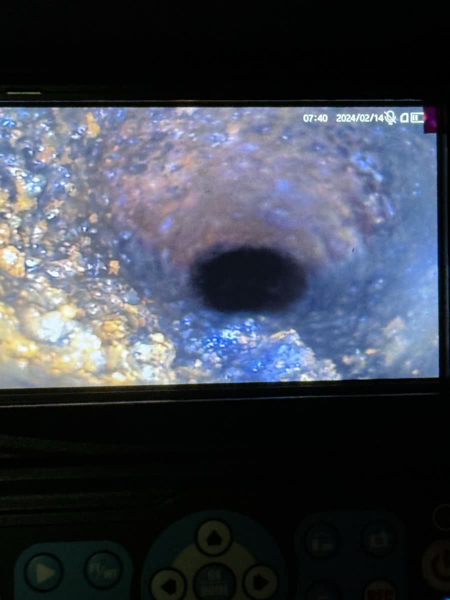 Drain camera monitor showing a view inside a pipe