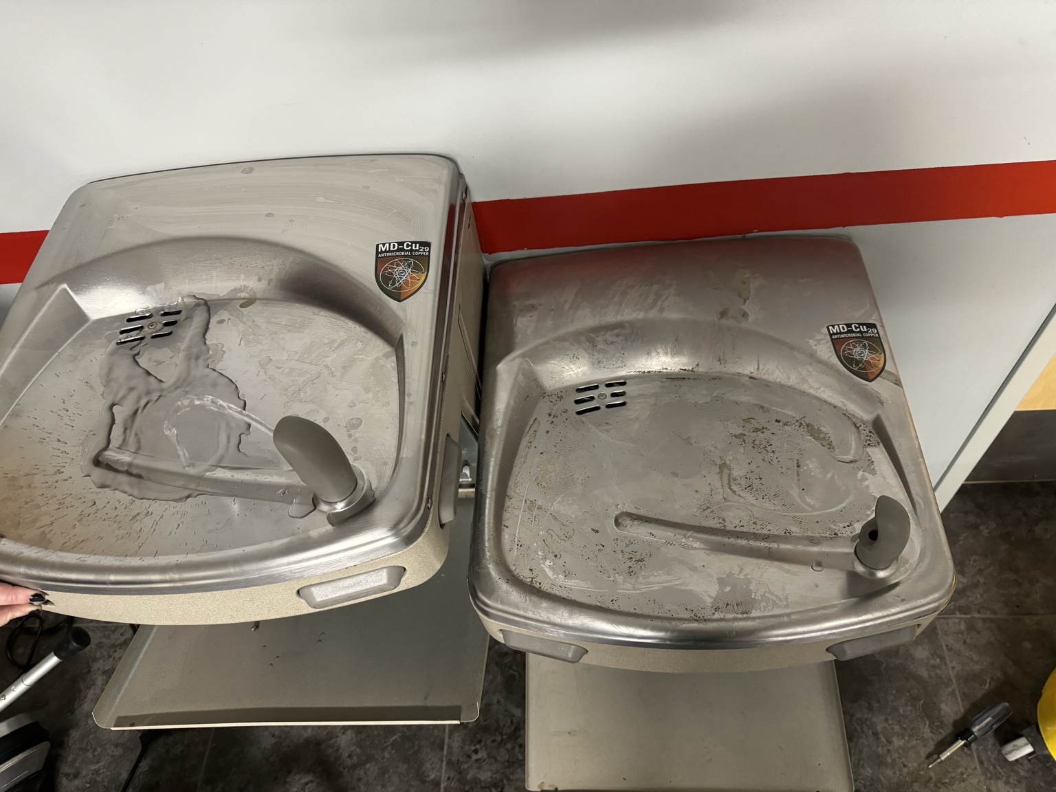Before and after views of drinking fountains at a local auto glass business